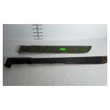 Machete with green nylon sheath, handle grip is