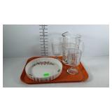 Beverage pitcher, 2 stemware goblets, and floral