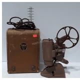 Ampro Percision Projector with cord, reel, and