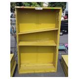 Yellow metal shelf five feet tall