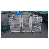 Three metal storage carts