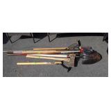 Group of long handled tools, includes shovels,