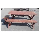 Wooden picnic table with two benches and extra
