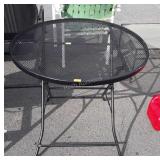 Wrought Iron folding patio table 32" in diameter