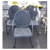 Three metal patio chairs