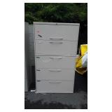 Five drawer metal filing cabinet 64" tall does