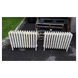 Two cast iron heaters 29" long