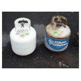 Two older full propane tanks