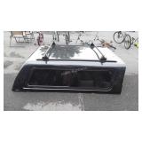 Green truck bed cover made by A.R.E is 80" long