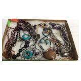 Flat of costume jewelry