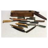 Wooden box with razors, straight razors, and