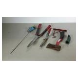 Garden lot. Hatchet, hose nozzle, hedge