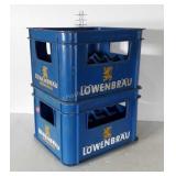Two plastic Lowenbrau, crates