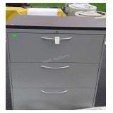 Three drawer metal filing cabinet 41" tall, does