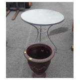Poly planter and round glass top patio table,