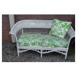 Wicker patio sofa with green cushions five feet