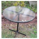 Glass top patio table 29" in diameter and 29"