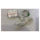 Two Apple headphones and a charging cord for iPod
