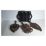 Three cast iron rivets and an iron cookie pan