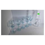 A glass carafe and 5 wine glasses