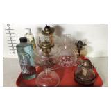 Oil lamp lot with four bases, one shade, and two