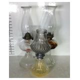 Three oil lamps with chimneys