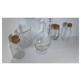 A Collection of glass items- 2 Pitchers, 3 jars