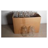 A box lot of 24oz 28 jars