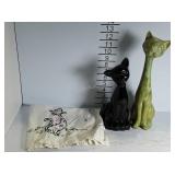 Two ceramic cats and a cotton cloth cat towel