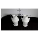 A pair of white glass vases