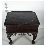 Box covered in embossed metal on heavy metal