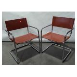 Two Framed chrome tubular cantilever chair, with
