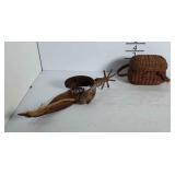 An old cowboy spur and a small wicker basket