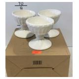 Three sundae cups with writing utensil and