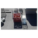 Crate with extension cords, and small animal trap