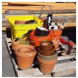 Skid lot, includes planters, and bucket of misc