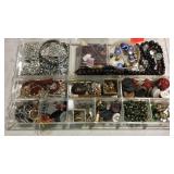 Tray of jewelry and buttons
