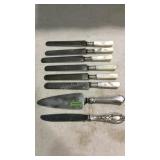 Six Sterling band and MOP handled butter knives