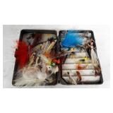 Small box of fly fishing flies.