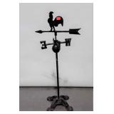 Cast iron weather vane on stand with rooster top