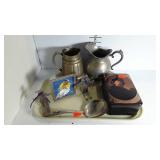 Two pitchers, a serving spoon, Shakespeare tin and