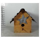 Birdhouse: wooden with metal roof.