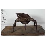 Old iron cherry pitter mounted to wood.