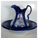 Wash bowl with pitcher. Pitcher has daisies &