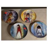 Four Ted Degrazia numbered plates.