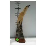 Carved bird statue