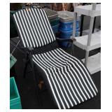 Green and white striped lounge chair