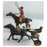 Two cast iron horse and riders figurines