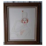 Clown painting on canvas in thick wooden frame.