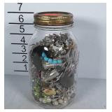 Ball jar filled with costume jewelry
